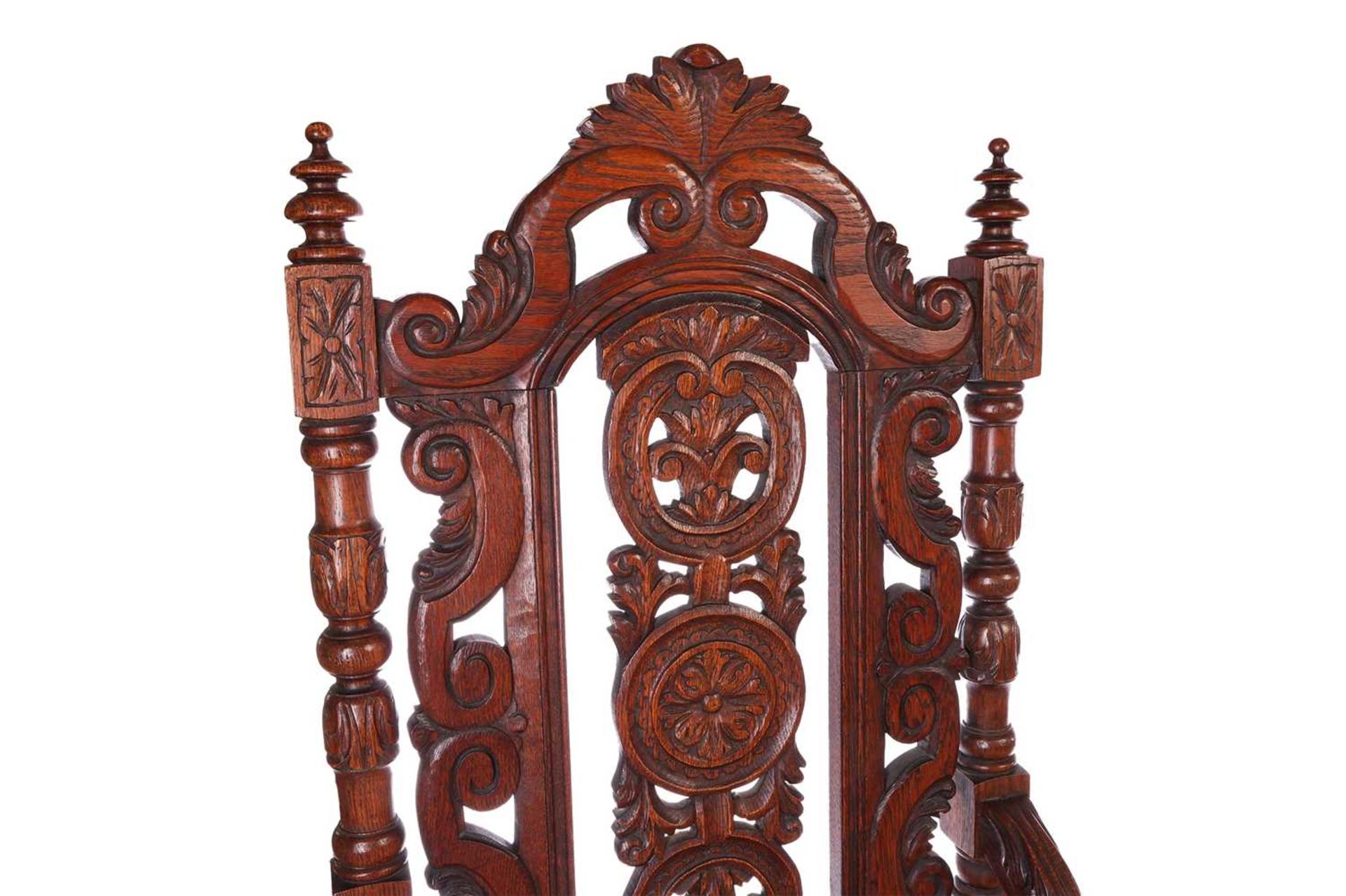 A near pair of Victorian carved oak open armchairs, in the Carolean style, with open S-Scroll, roset - Image 4 of 6