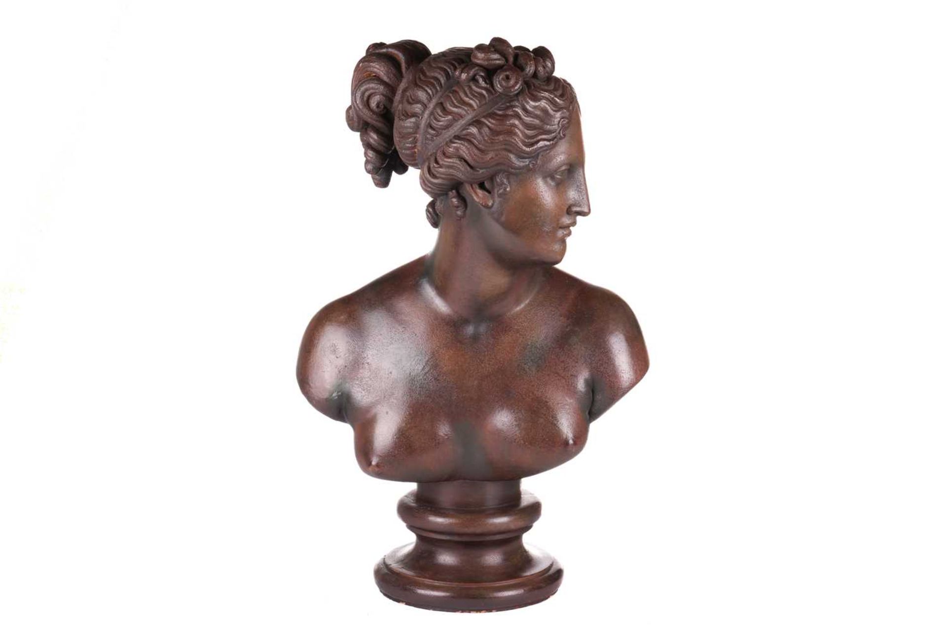 After the antique, a large eathernware and composite bust of Diana, with bronzed finish, on an inter