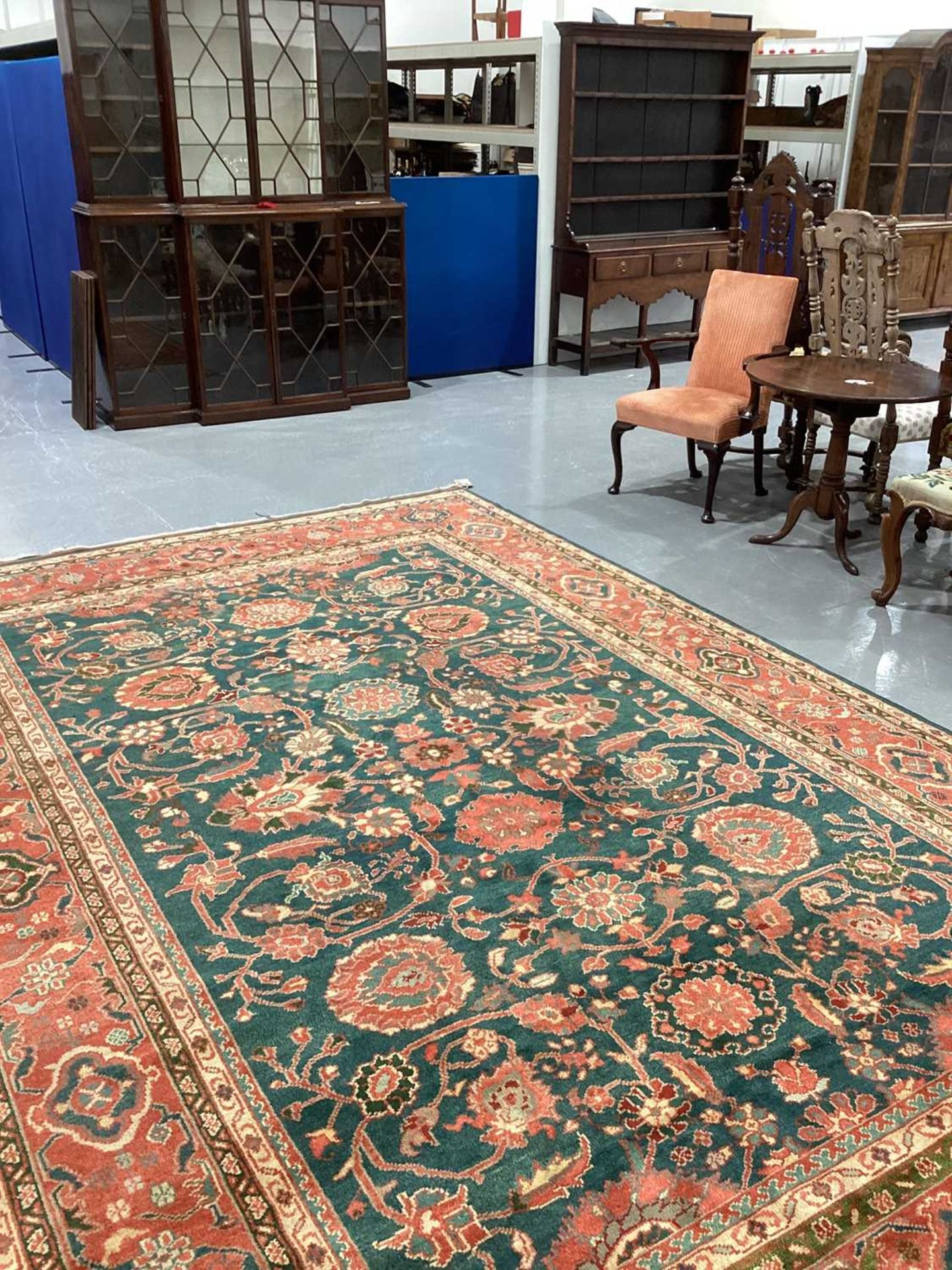 A large Ushak Carpet, the red palmette and leaf design on a blue/green field, within a light red bor - Image 23 of 23