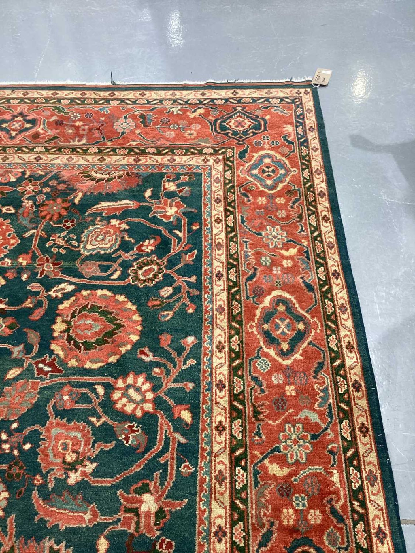 A large Ushak Carpet, the red palmette and leaf design on a blue/green field, within a light red bor - Image 15 of 23