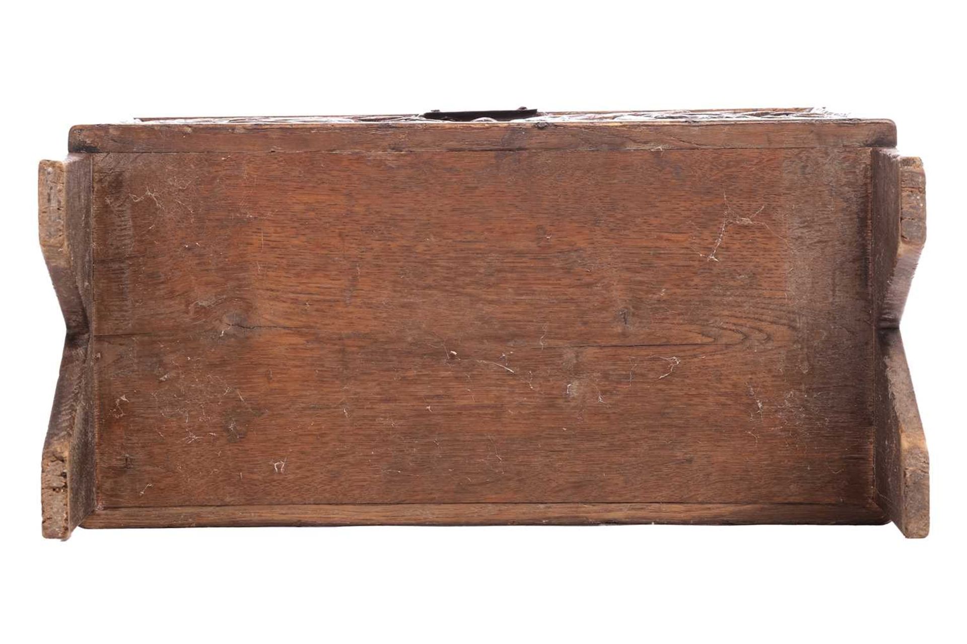 A small 17th-century style oak six-plank coffer, the frieze carved with Romanesque portrait roundels - Image 6 of 6