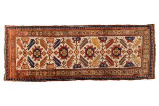 A Kazak Rug, the serrated leaf and medallion design on an ivory field, within a star and serrated
