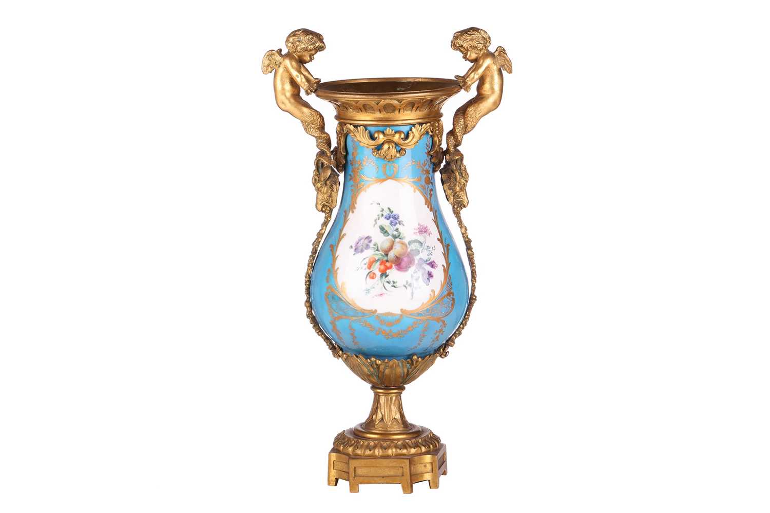 A French Napoleon III Sevres porcelain baluster base painted with scattered blooms and fruits on a B