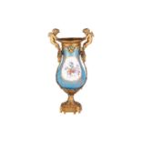 A French Napoleon III Sevres porcelain baluster base painted with scattered blooms and fruits on a B