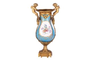 A French Napoleon III Sevres porcelain baluster base painted with scattered blooms and fruits on a