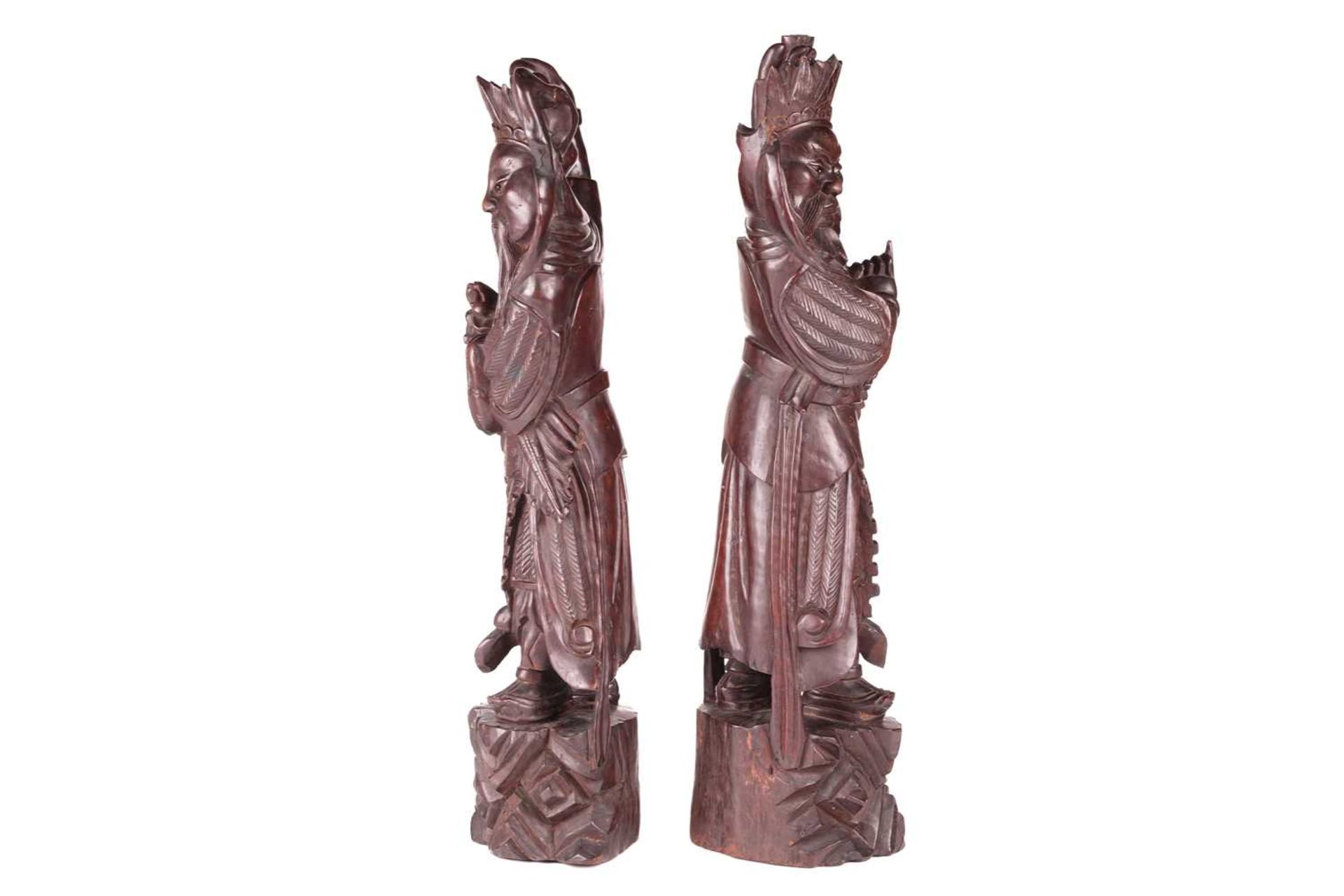 A pair of Chinese carved cherry wood figures of warriors one possibly Xianwu both with inset glass b - Image 2 of 11