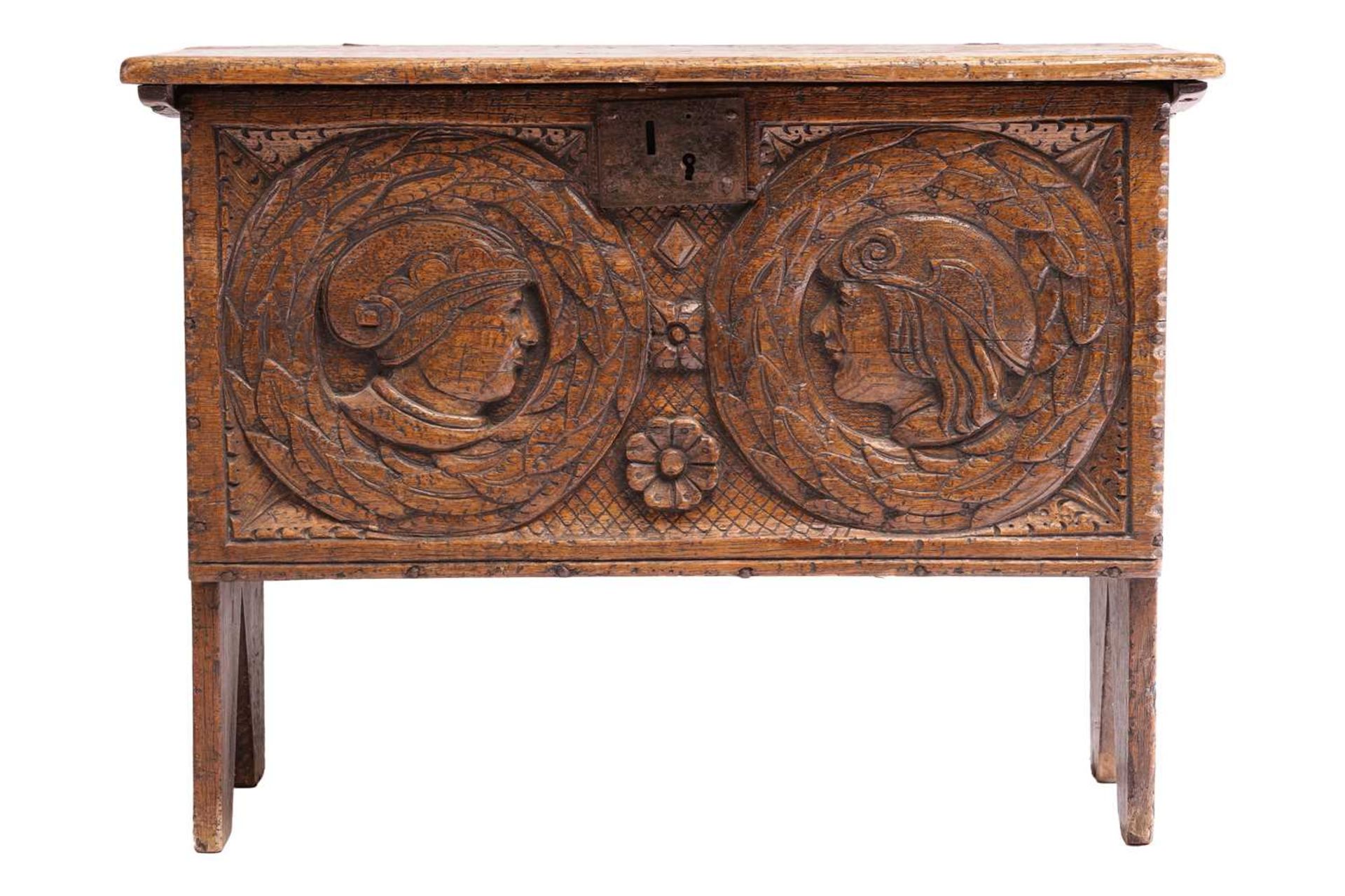A small 17th-century style oak six-plank coffer, the frieze carved with Romanesque portrait roundels - Image 2 of 6