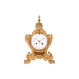 A late 19th/early 20th-century French gilt metal mantel clock, the foliate scroll form case with fla