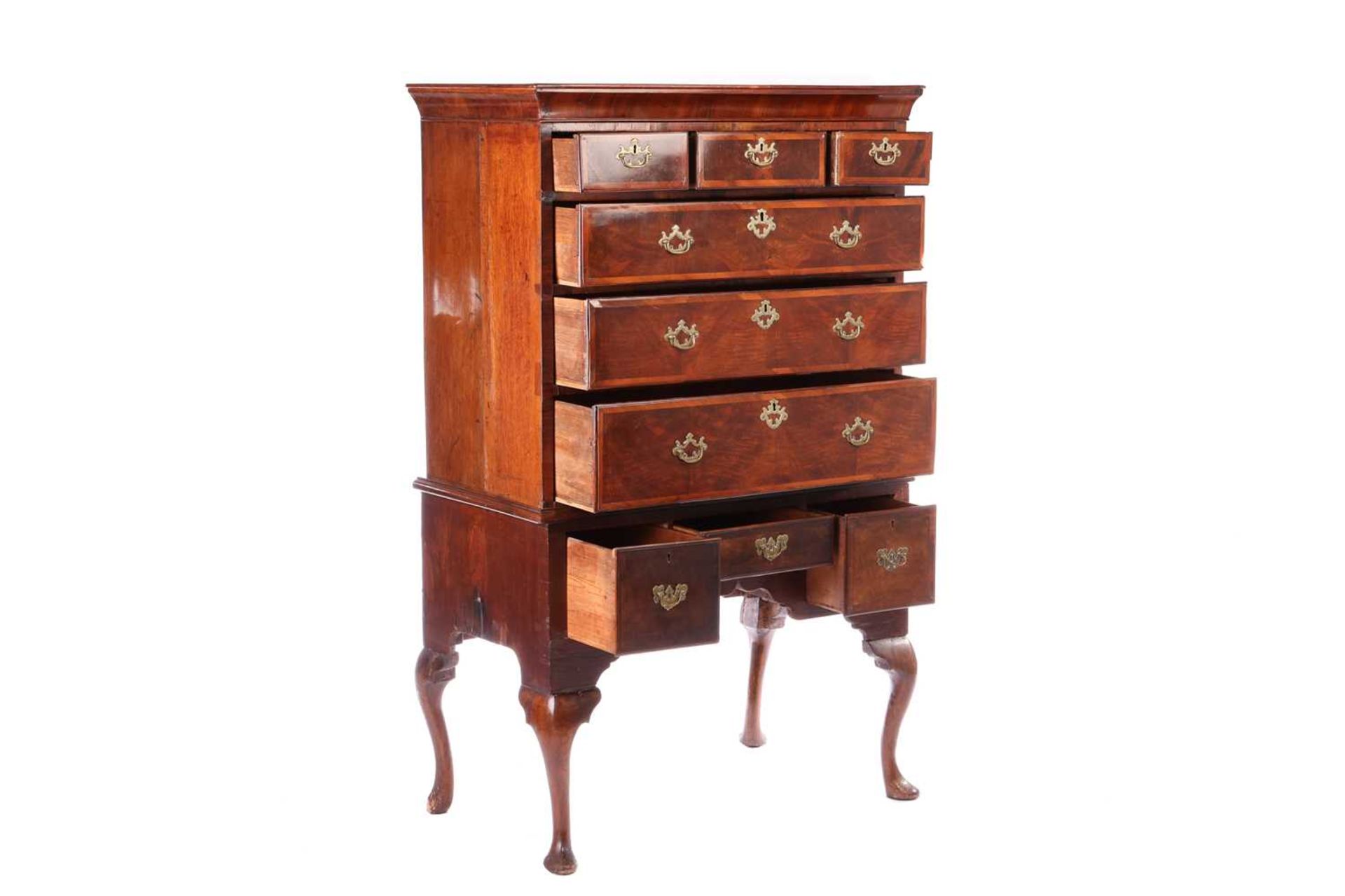 A George II walnut chest on stand, with diagonal crossbanding, the cavetto moulded cornice over thre - Bild 2 aus 7