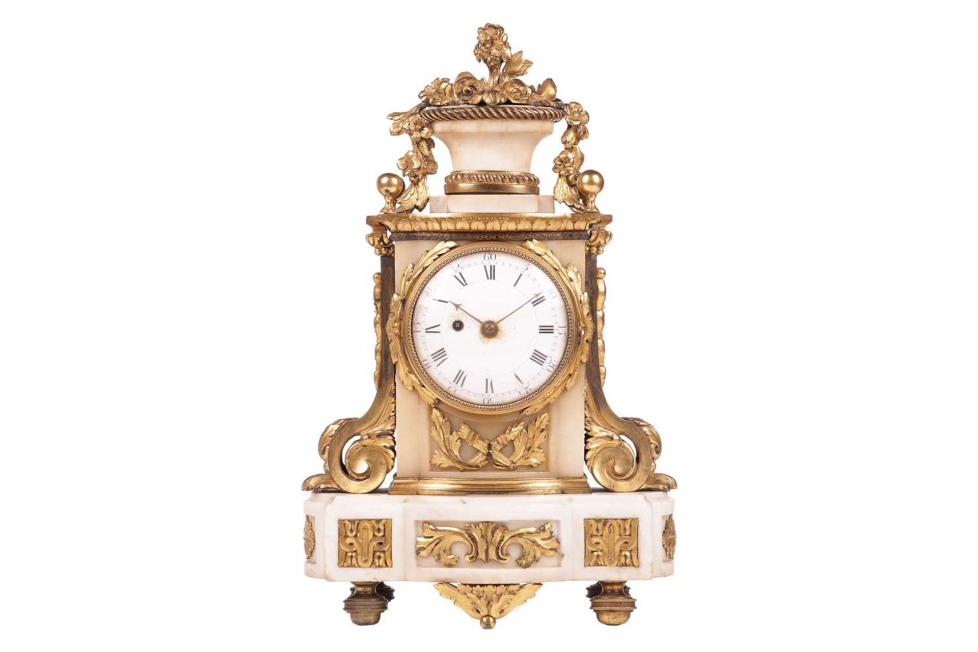 A late 19th century French white marble and gilt metal mantel timepiece clock, the top with a basket