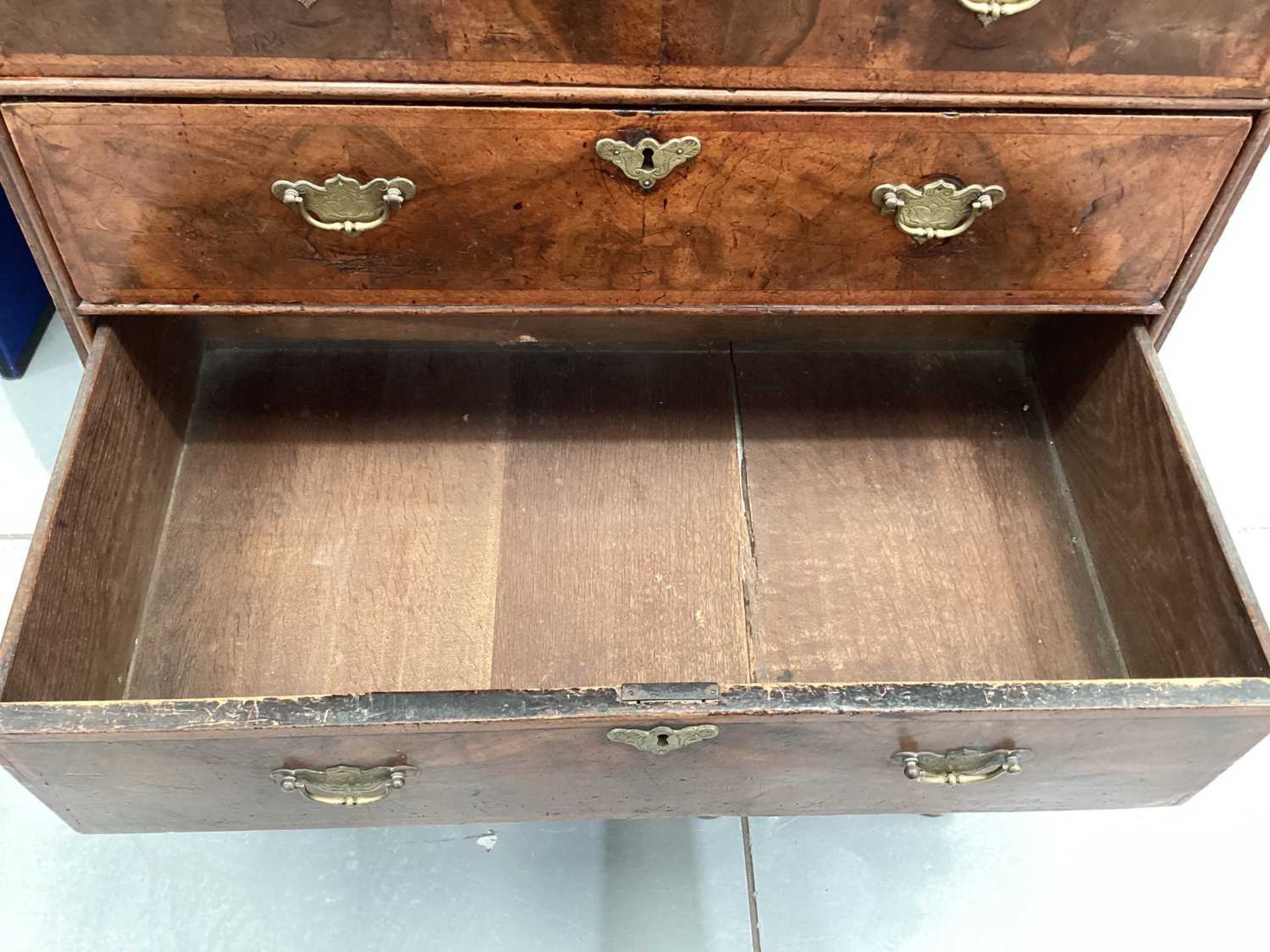 A 17th-century and later figured walnut chest on stand, the upper section with quarter veneered top  - Image 20 of 22