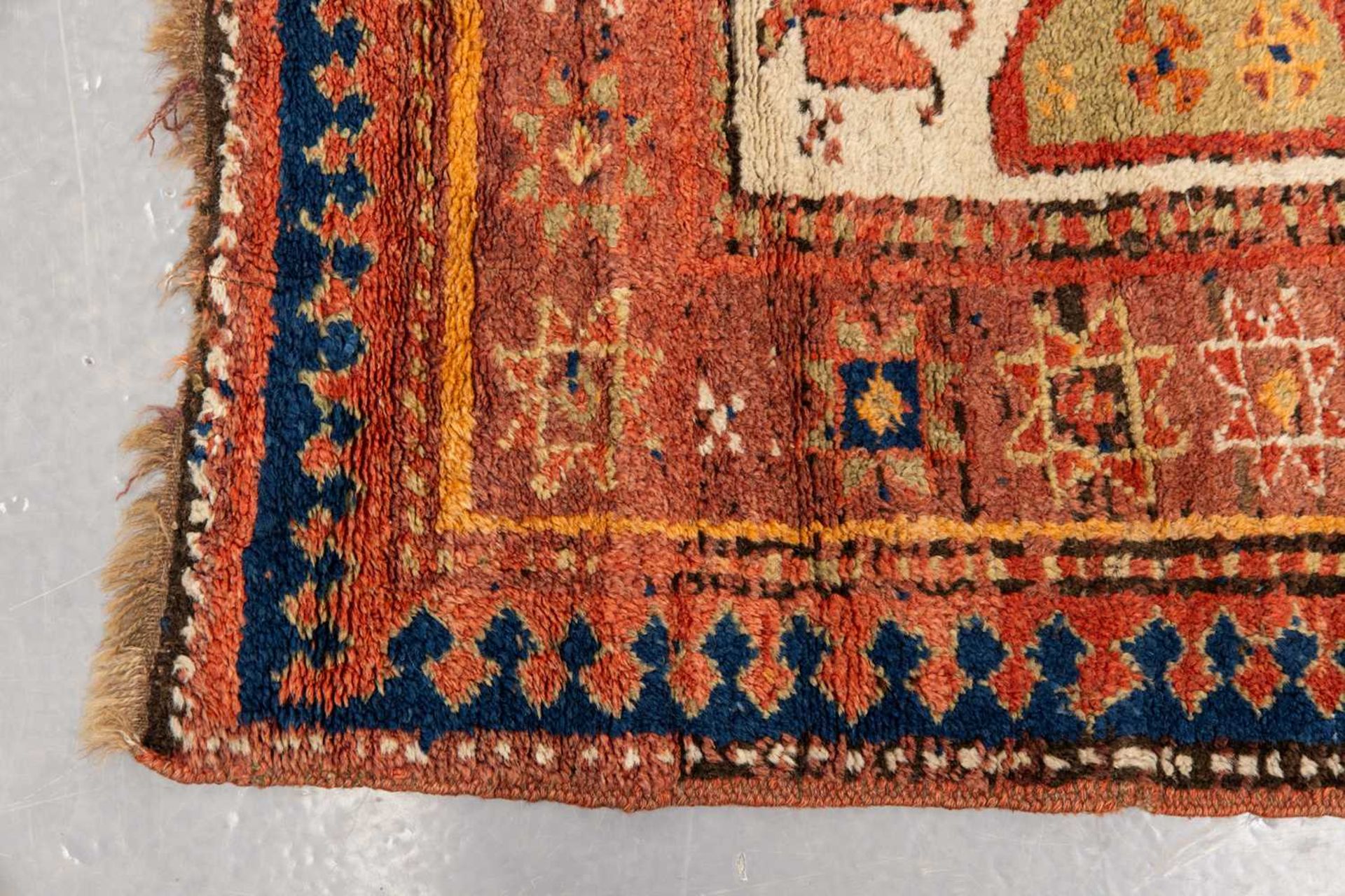 A Kazak Rug, the serrated leaf and medallion design on an ivory field, within a star and serrated bo - Image 4 of 6