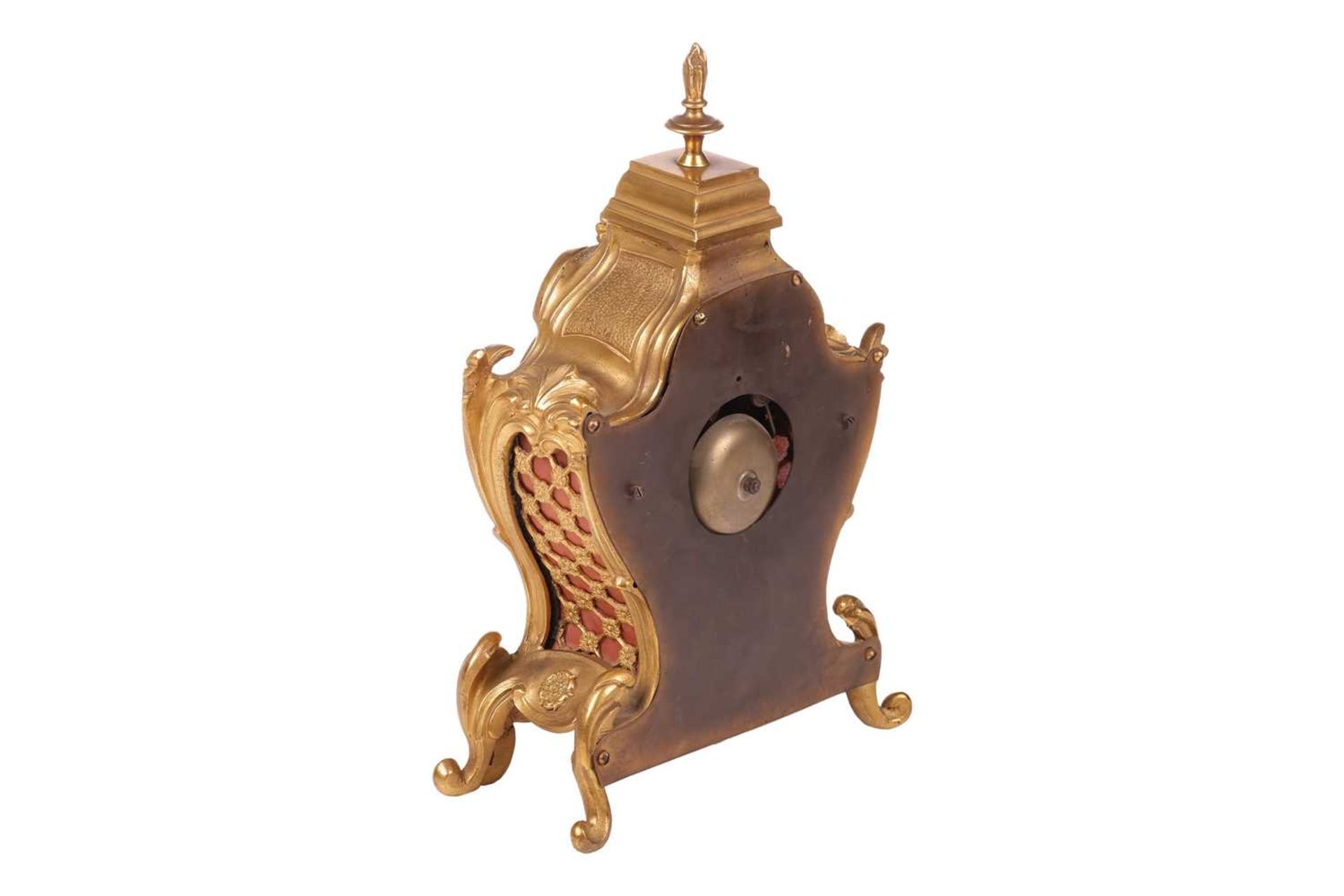 A late 19th/early 20th-century French gilt metal mantel clock, the foliate scroll form case with fla - Image 3 of 7