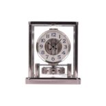 A Jaeger Le Coultre Rhodium plated Atmos 'Classique' mantel clock, the circular dial bearing Arabic 
