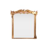 A 19th century giltwood overmantel mirror, the shaped top with applied floral sprays, foliate scroll