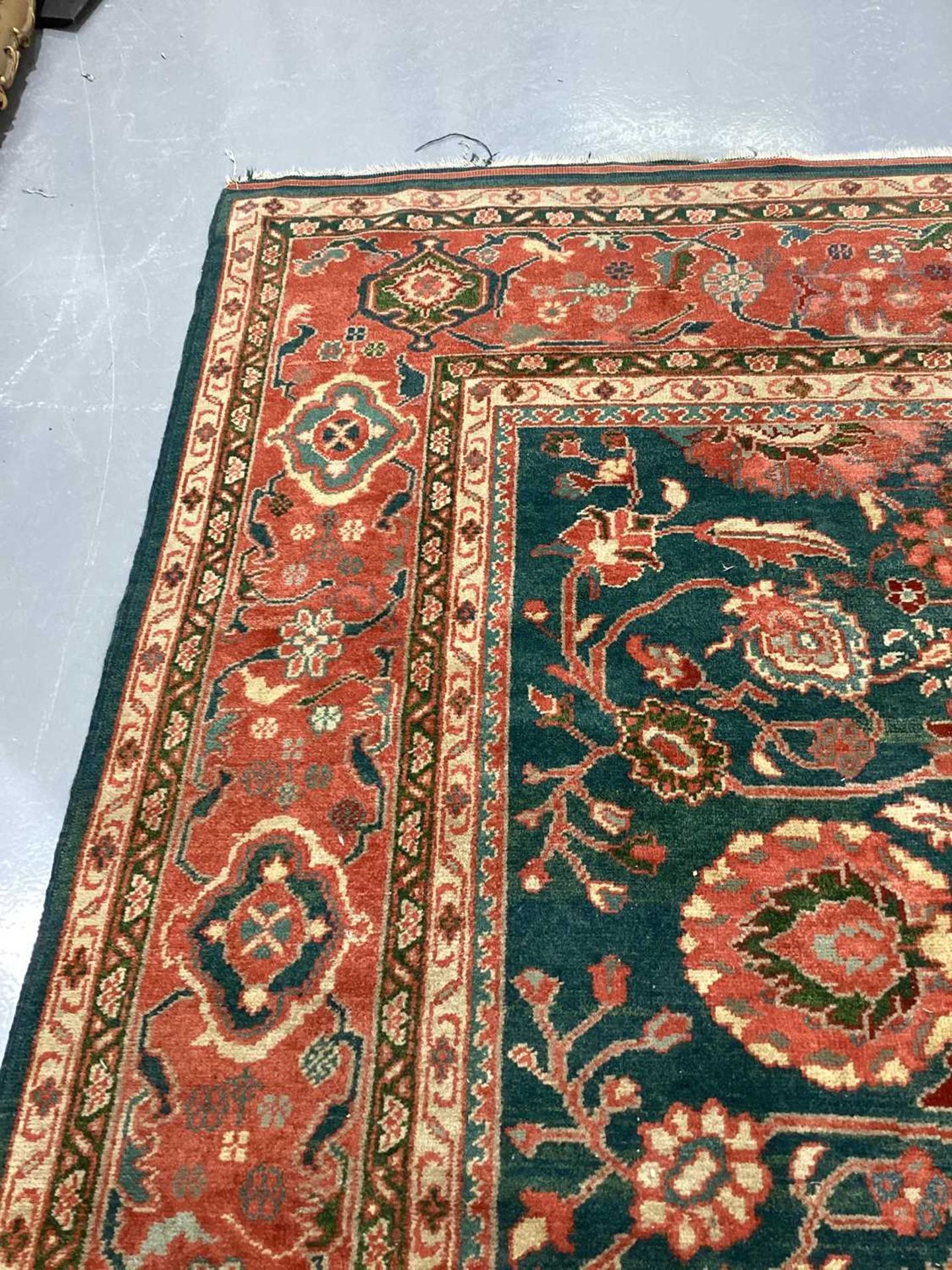 A large Ushak Carpet, the red palmette and leaf design on a blue/green field, within a light red bor - Image 13 of 23