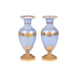 A pair of late 19th century French blue opaline glass and ormolu mounted vases, with gilt-overlaid d