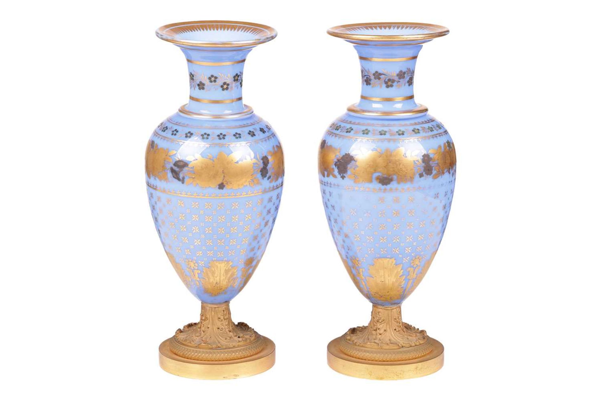 A pair of late 19th century French blue opaline glass and ormolu mounted vases, with gilt-overlaid d