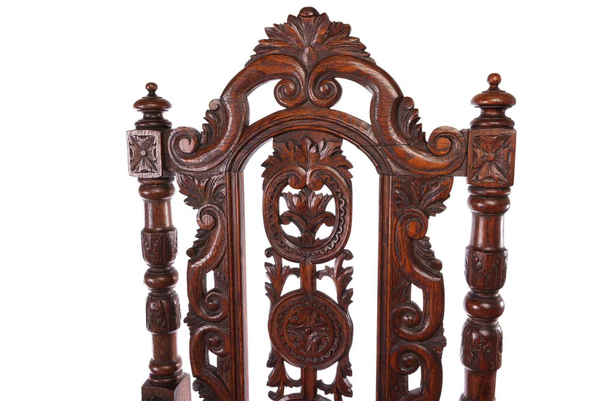 A near pair of Victorian carved oak open armchairs, in the Carolean style, with open S-Scroll, roset - Image 6 of 6