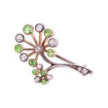 A diamond and tsavorite garnet spray brooch, designed in the form of a dandelion seed head with alte