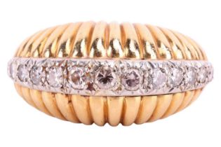 A mid-century, diamond set, bombé style dress ring; with a central band of fifteen graduated, pavé