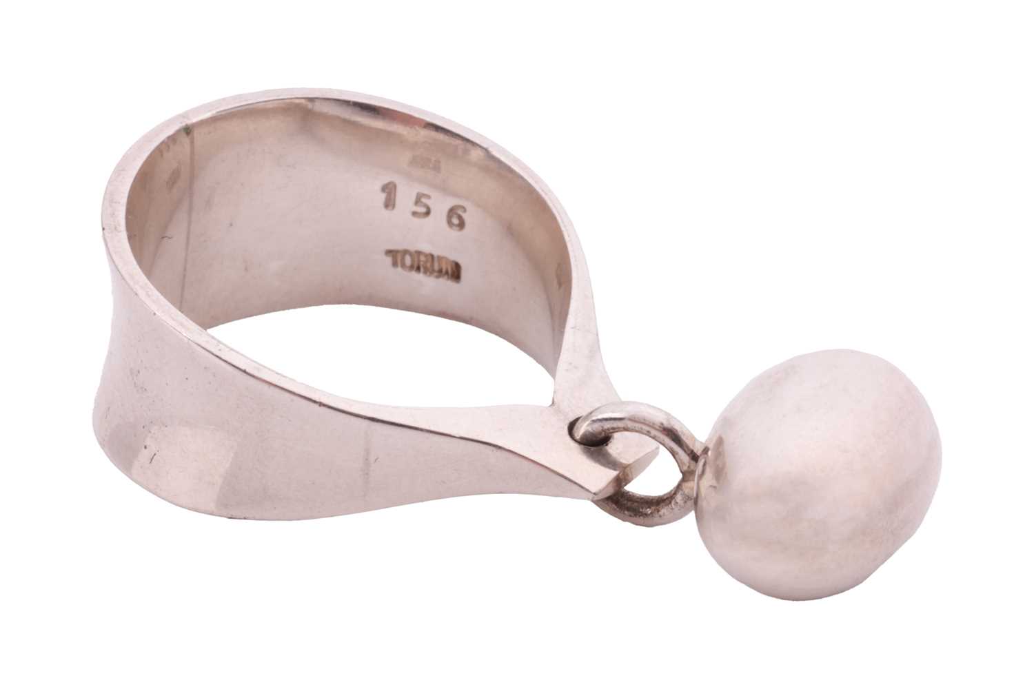Georg Jensen - 'Pod' ring, dangling with a hollow egg-shaped charm attached to a concave ring band, 
