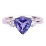 A trilliant-cut tanzanite and diamond ring in 18ct white gold, centred with tanzanite of bright blui