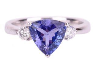 A trilliant-cut tanzanite and diamond ring in 18ct white gold, centred with tanzanite of bright