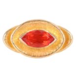 A Modernist cocktail ring set with fire opal, the marquise-cut fire opal of intense reddish-orange c