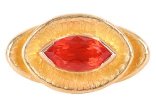 A Modernist cocktail ring set with fire opal, the marquise-cut fire opal of intense reddish-orange
