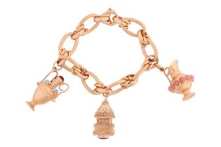 A charm bracelet comprising a series of hollow fancy links, suspending three charms of amphora