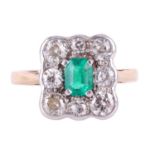 An emerald and diamond cluster ring, centred with an emerald-cut emerald of bright green colour, app