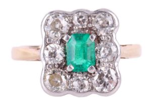 An emerald and diamond cluster ring, centred with an emerald-cut emerald of bright green colour,