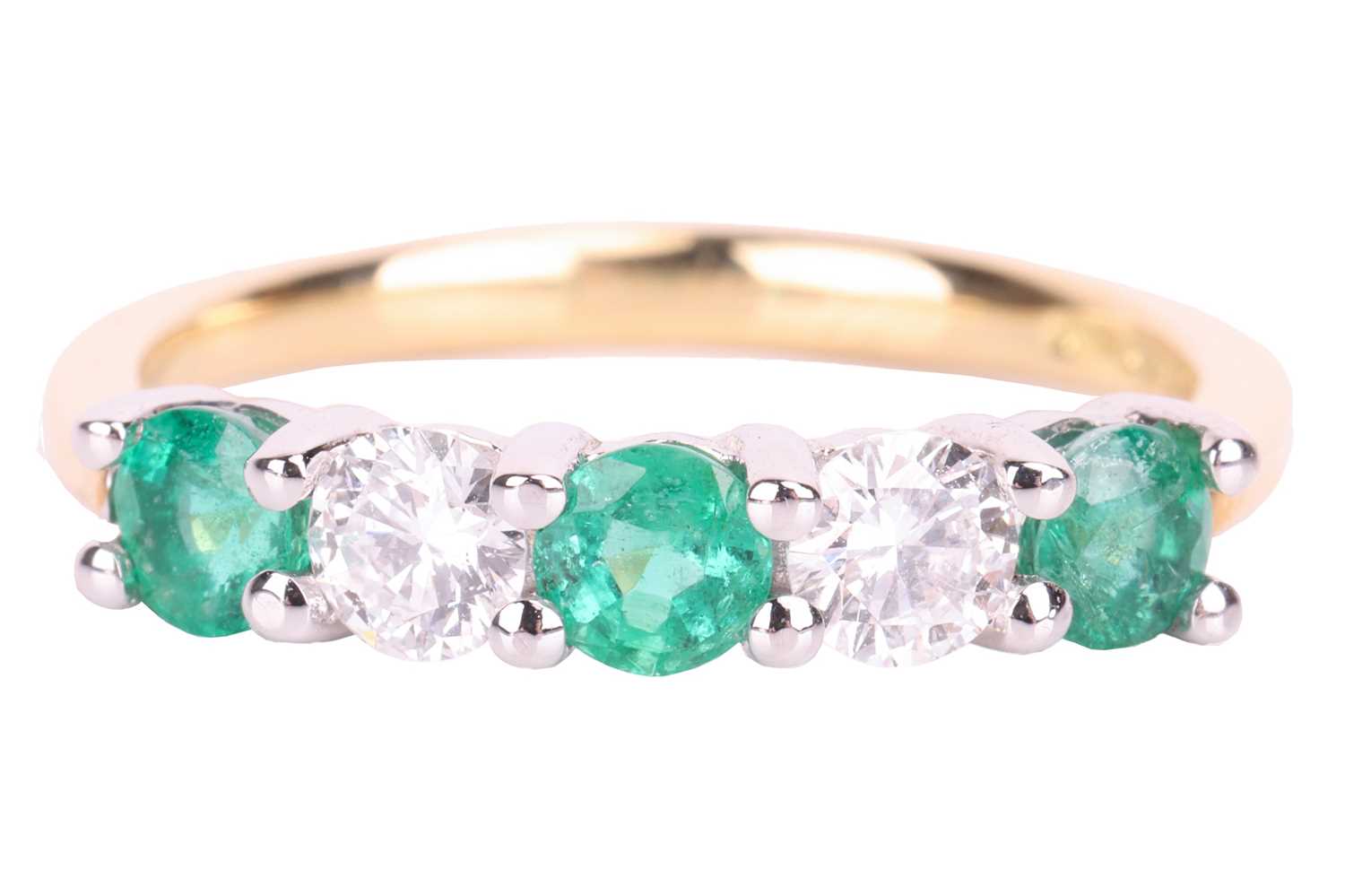 An emerald and diamond half-hoop ring in 18ct gold, alternating with circular-cut emeralds and brill