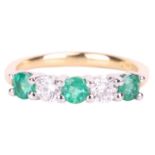 An emerald and diamond half-hoop ring in 18ct gold, alternating with circular-cut emeralds and brill