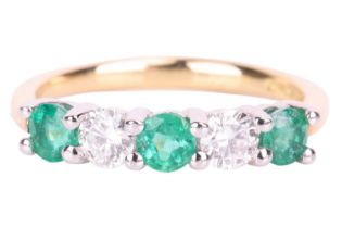 An emerald and diamond half-hoop ring in 18ct gold, alternating with circular-cut emeralds and