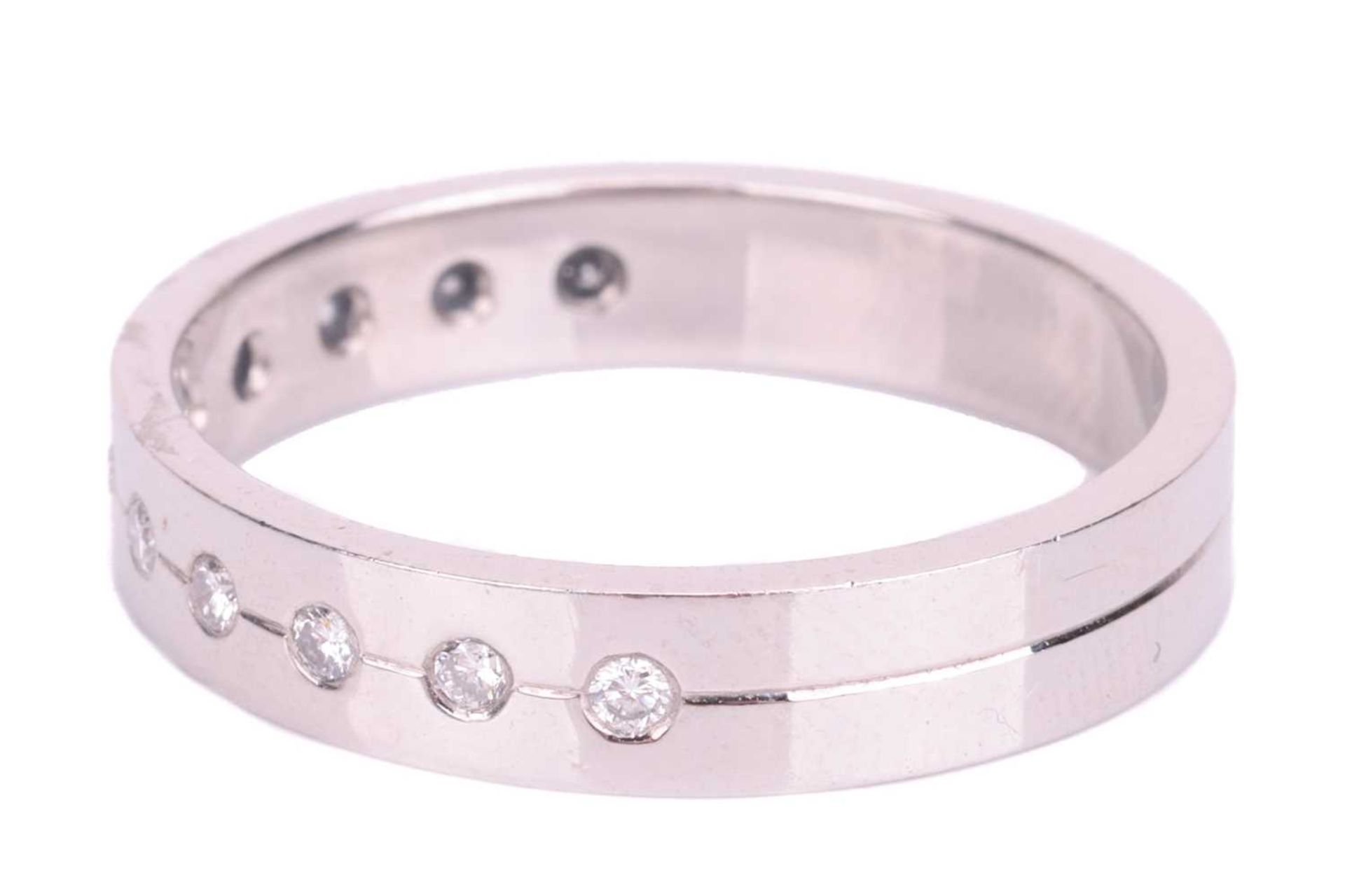 A diamond half eternity ring in platinum, set with a central row of eleven round brilliant cut diamo - Image 3 of 5