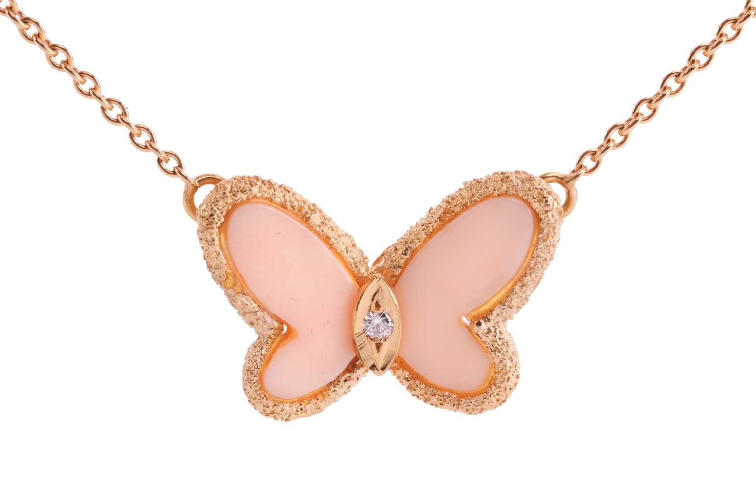 Van Cleef & Arpels - a butterfly necklace set with angel skin coral and diamond, circa 1970, wings