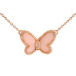 Van Cleef & Arpels - a butterfly necklace set with angel skin coral and diamond, circa 1970, wings