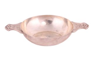 A silver quaich with Celtic design by Wakely & Wheeler, London 1945, plain circular bowl with both
