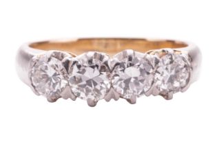 A four stone half hoop diamond ring; the four round brilliant cut diamonds in claw settings to a