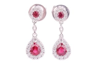 A pair of ruby and diamond cluster drop earrings, featuring pear-shaped rubies surrounded by round