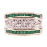 A gem-set ring, featuring cubic zirconia to the centre in a geometrical design setting, flanked by t