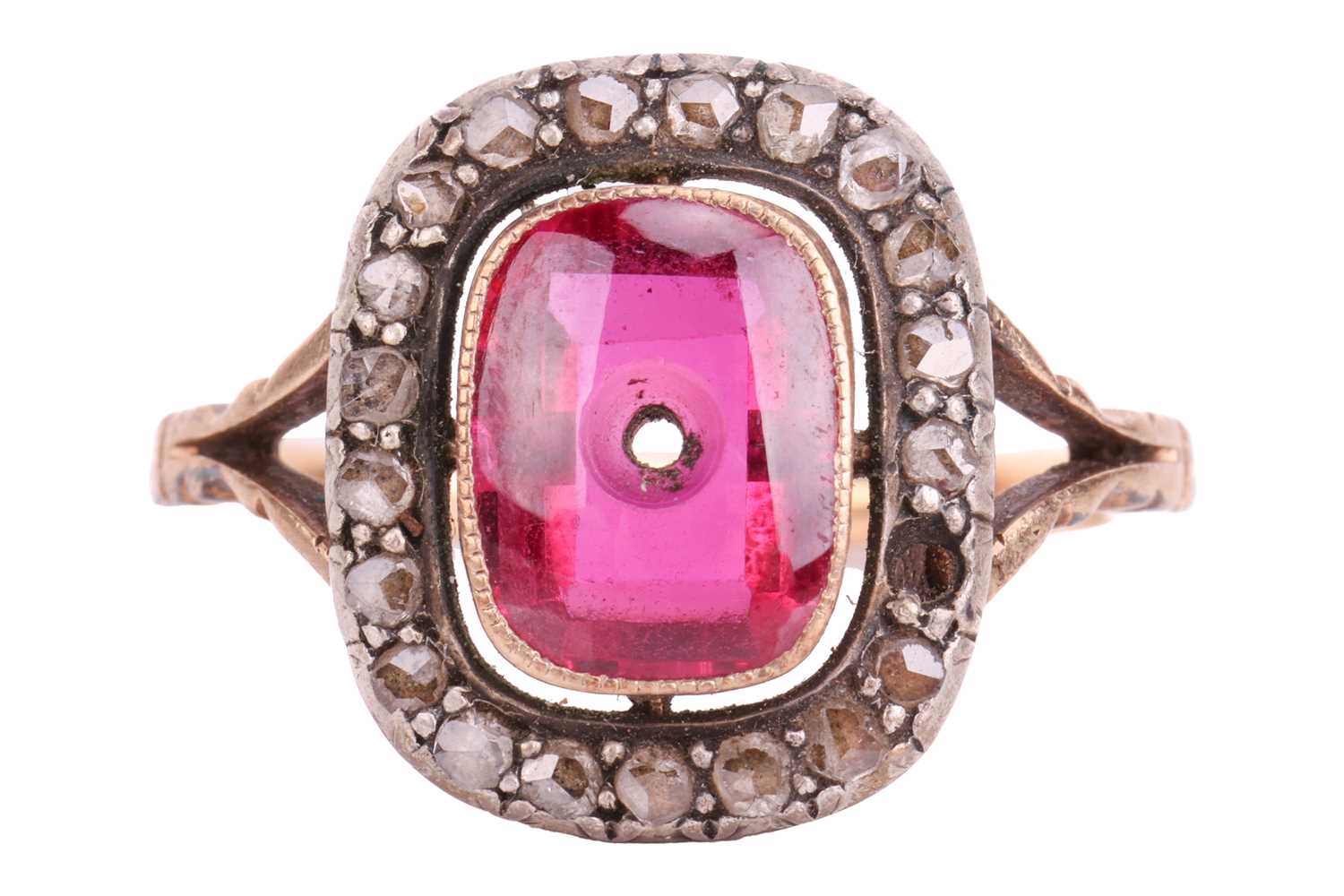 A diamond and synthetic ruby panel ring, centred with an empty cushion-shaped synthetic ruby panel, 