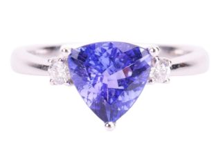 A trilliant-cut tanzanite and diamond ring in 18ct white gold, centred with tanzanite of bright