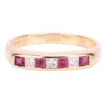 A ruby and diamond-set ring, featuring seven square-cut rubies and diamonds channel-set in an 18ct y