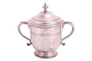 A Queen Anne silver two handled cup and cover by Francis Garthorne, London 1706, the domed cover wit