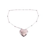 Georg Jensen - a large 'Joy' heart necklace, with a hollow heart-shaped pendant, attached to a serie