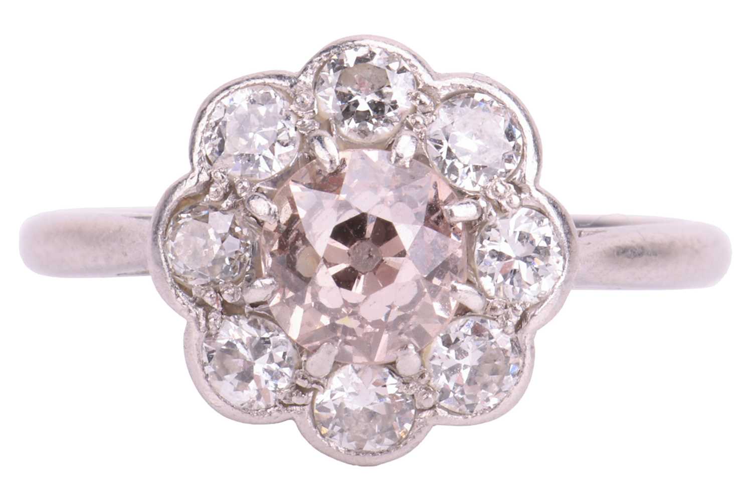 An Edwardian diamond daisy cluster ring, centred with an old European round diamond of "Very Light P