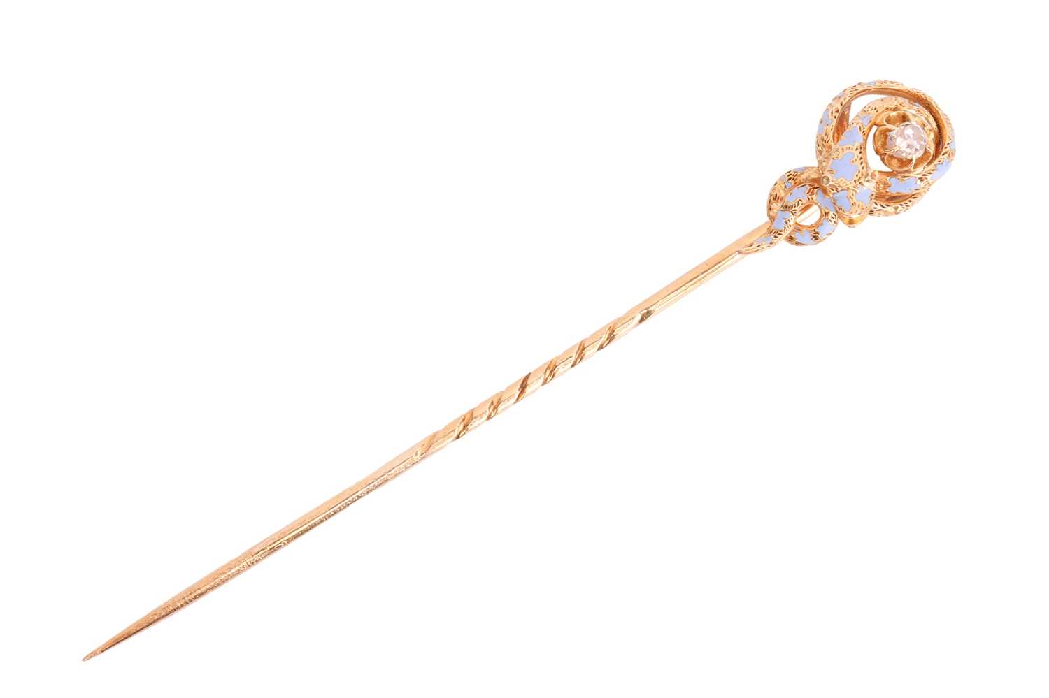 A diamond-set enamel serpent stick pin, featuring a coiled snake wrapping around an old-cut diamond 